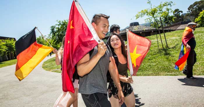 Students holding various flags