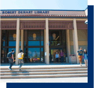 students on steps of large library