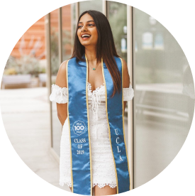 young woman with blue graduation sash