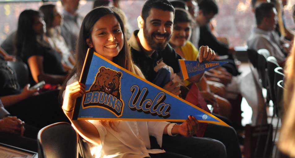 students holding UCLA banners